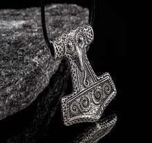 Viking Thor's Hammer Mjolnir pendant, intricately detailed silver-tone metal on a black cord.