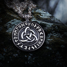 Viking silver Triquetra Futhark rune eternity necklace with intricate knotwork on a dark, textured surface.