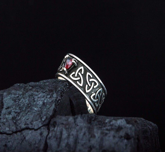 Viking sterling silver Triquetra ring with red cubic zirconia, Celtic knot band.