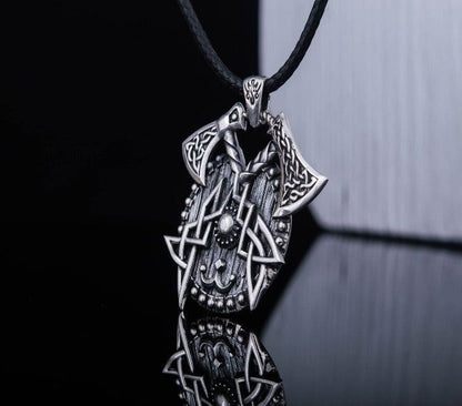 Sterling silver Viking axes and shield necklace with intricate Norse knotwork on a black cord.