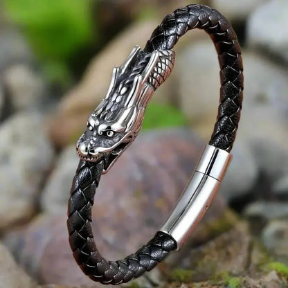 Viking dragon bracelet: black braided leather strap, silver dragon head, and sleek metal clasp.