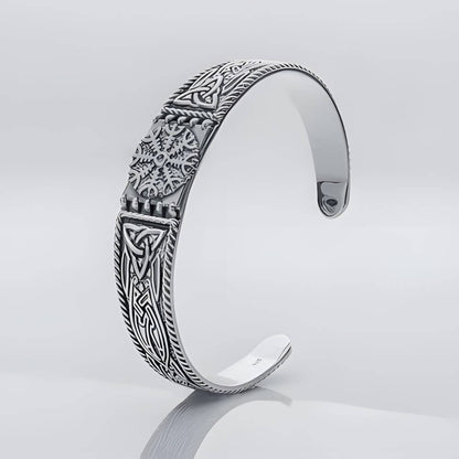 Viking Helm of Awe silver cuff bracelet with intricate Celtic knotwork and runic symbols.