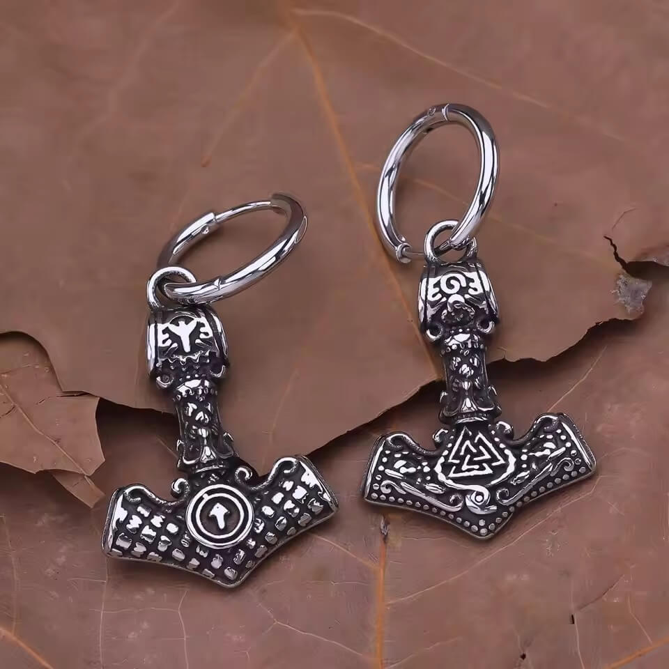Viking Mjölnir hoop earrings in silver-tone metal, featuring Tyr's Rune and Valknut details.