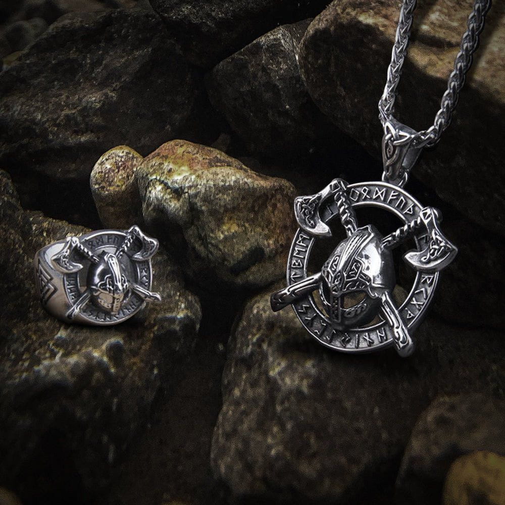Viking silver necklace and ring set with helmet and crossed axes design, featuring runic symbols.