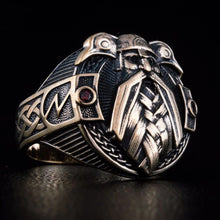 Viking Odin ring in bronze with intricate raven and knotwork details, featuring red gemstones.