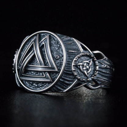 Viking sterling silver ring with a prominent Valknut symbol and intricate knotwork.