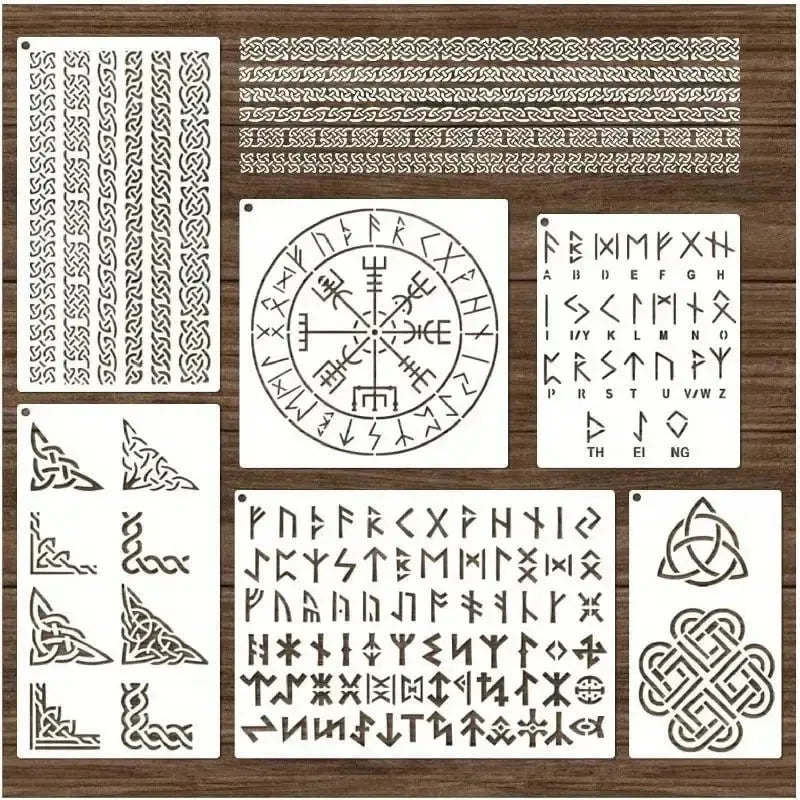 White Viking rune stencils with Norse symbols, Celtic borders, and alphabet designs on a wooden background.