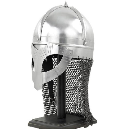 Viking steel war helm with face guard and chainmail aventail on a black stand.