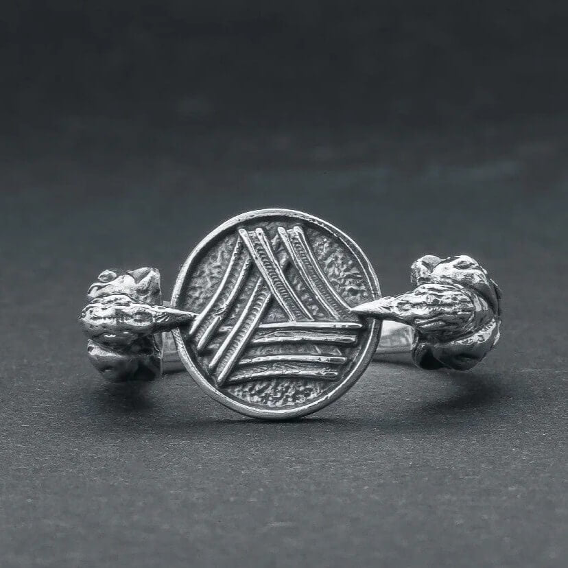 Viking Valknut Huginn Muninn silver ring with detailed raven heads on a dark background.