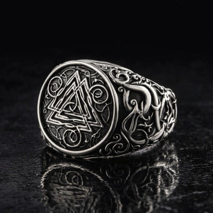 Viking Valknut ornamental silver signet ring with intricate knotwork on a dark background.