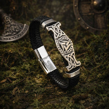 Viking Valknut Rune braided black leather bracelet with silver-tone metal clasp and ornate centerpiece.