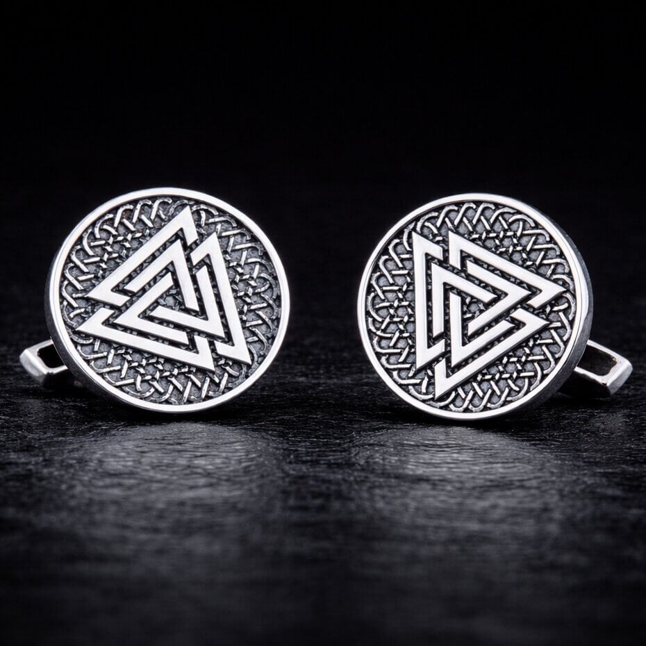 Viking Valknut silver cufflinks with intricate Celtic knotwork design on a dark background.