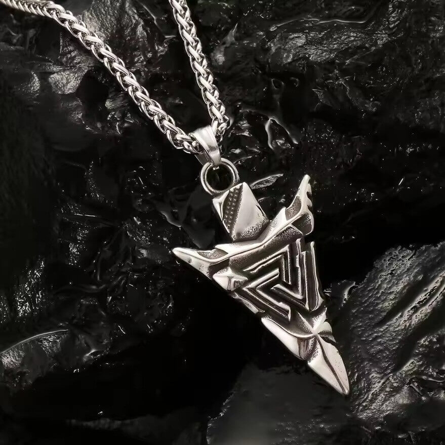 Viking silver-tone Valknut spearhead pendant necklace with a detailed Tyr symbol on a dark background.