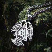 Silver Viking Valknut Talisman pendant with intricate knotwork on a thick chain, resting on moss.