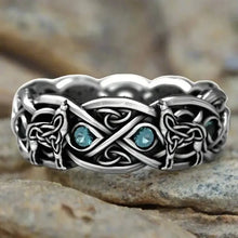 Viking sterling silver wolf ring with Celtic knotwork and blue cubic zirconia accents.