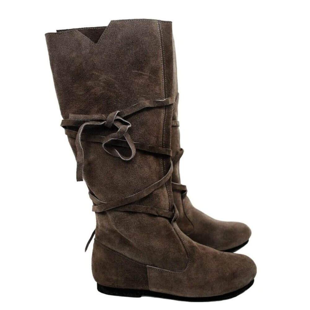 Pair of brown suede Viking wrap-tied boots with soft texture and long laces wrapped around mid-calf.