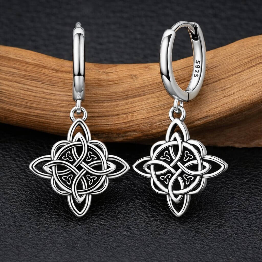 Celtic witch's knot star drop earrings in 925 sterling silver with Trinity knot accents on huggie hoops