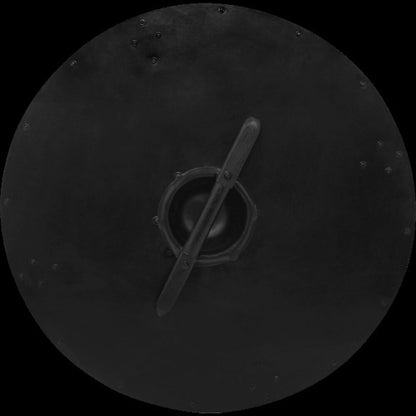 Back of a dark iron-rimmed round Viking shield with a wood-wrapped center handle and steel boss.