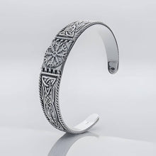 Silver Viking cuff bracelet featuring the Helm of Awe symbol at the center with carved knotwork panels on each side.