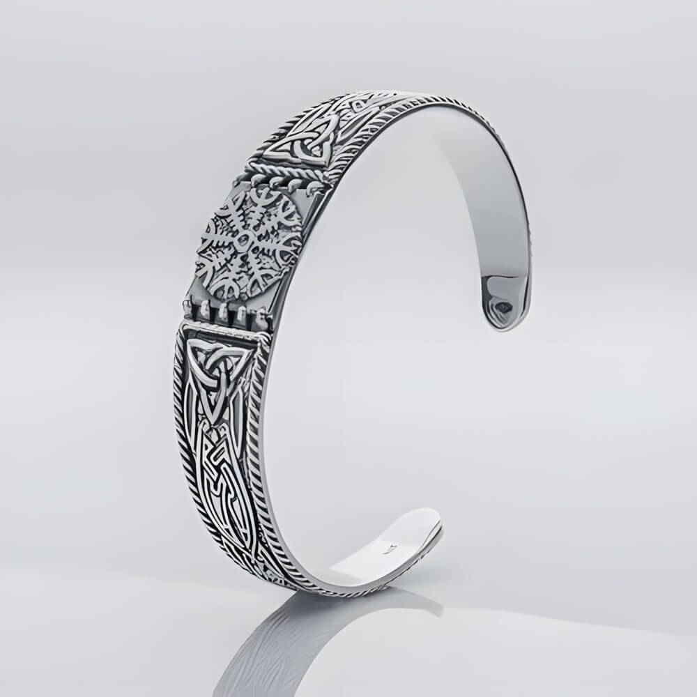 Silver Viking cuff bracelet featuring the Helm of Awe symbol at the center with carved knotwork panels on each side.
