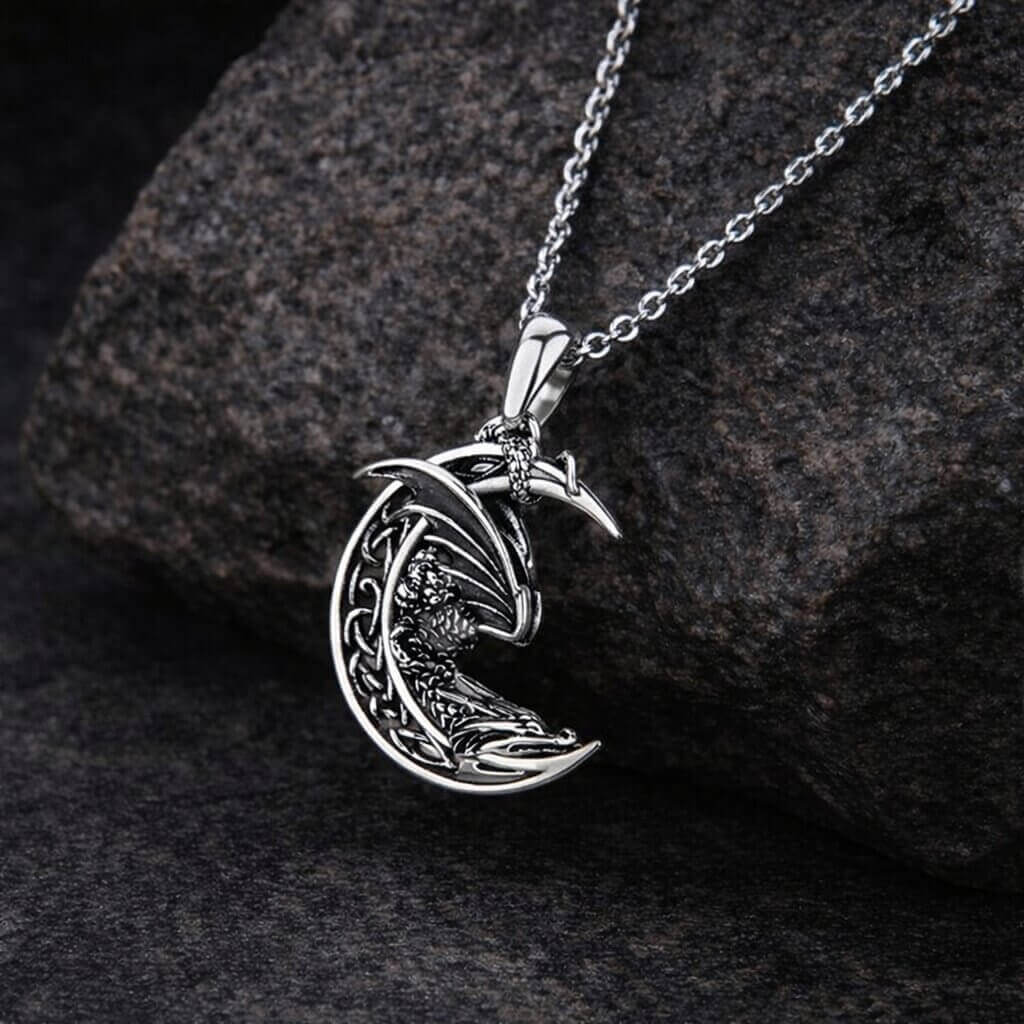 Sterling silver Viking Celtic moon dragon necklace with intricate knotwork.