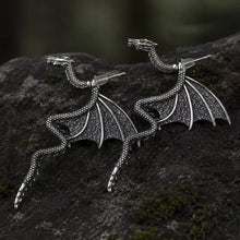 Silver Viking dragon earrings with detailed wings, scaled body, and Norse Nidhogg design