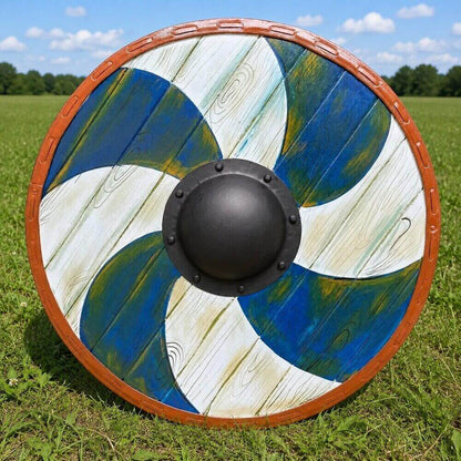 Handcrafted 22-inch Viking wooden round shield featuring alternating blue and white painted segments with natural wood grain texture – brown leather edge with riveted detail and black forged steel center boss – authentic Norse medieval armor for LARP and reenactment
