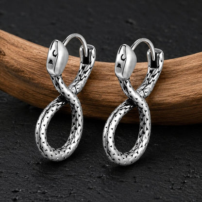 Silver Viking serpent hoop earrings with textured scale detailing and coiled snake design