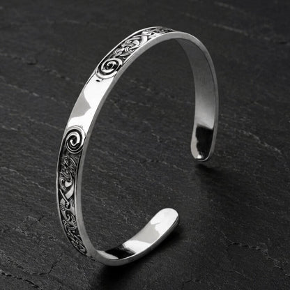 Viking Sterling Silver Cuff Bracelet featuring Celtic Spiral Knotwork - polished open cuff with spiral motifs and interwoven Celtic designs