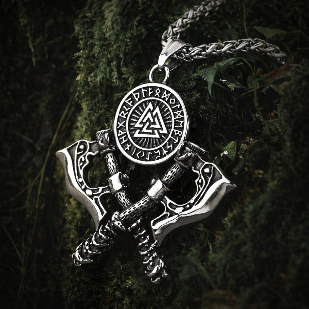 Viking Valknut axe pendant necklace featuring two crossed battle axes with engraved blades, a central Valknut symbol surrounded by Elder Futhark runes on a silver wheat chain.