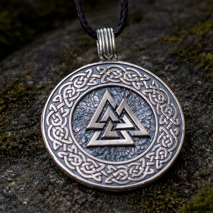 Viking Valknut Celtic knot pendant: silver-toned metal, black cord, dark background.