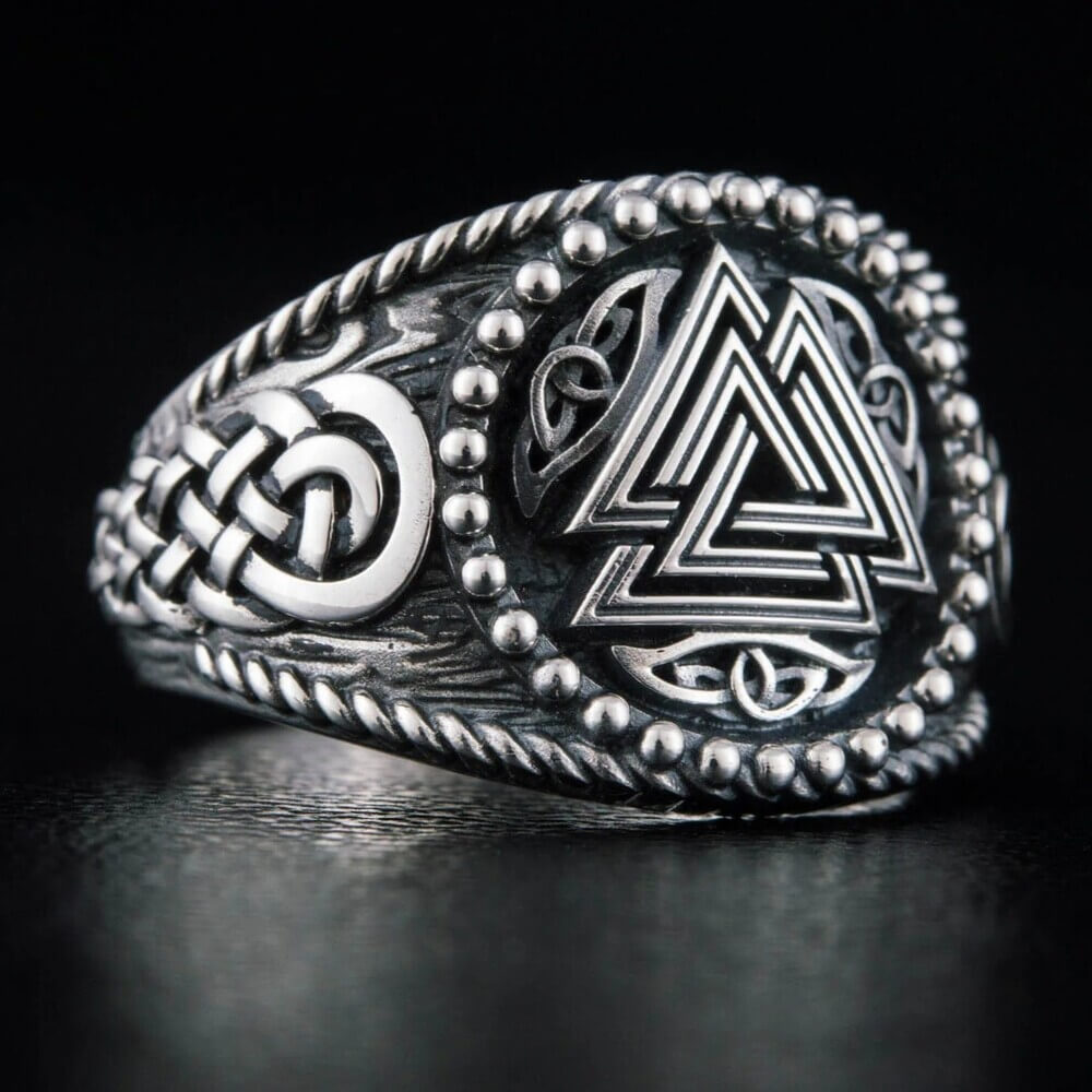 Viking silver ring with a Valknut Celtic knot design, rope edges, and beaded details.