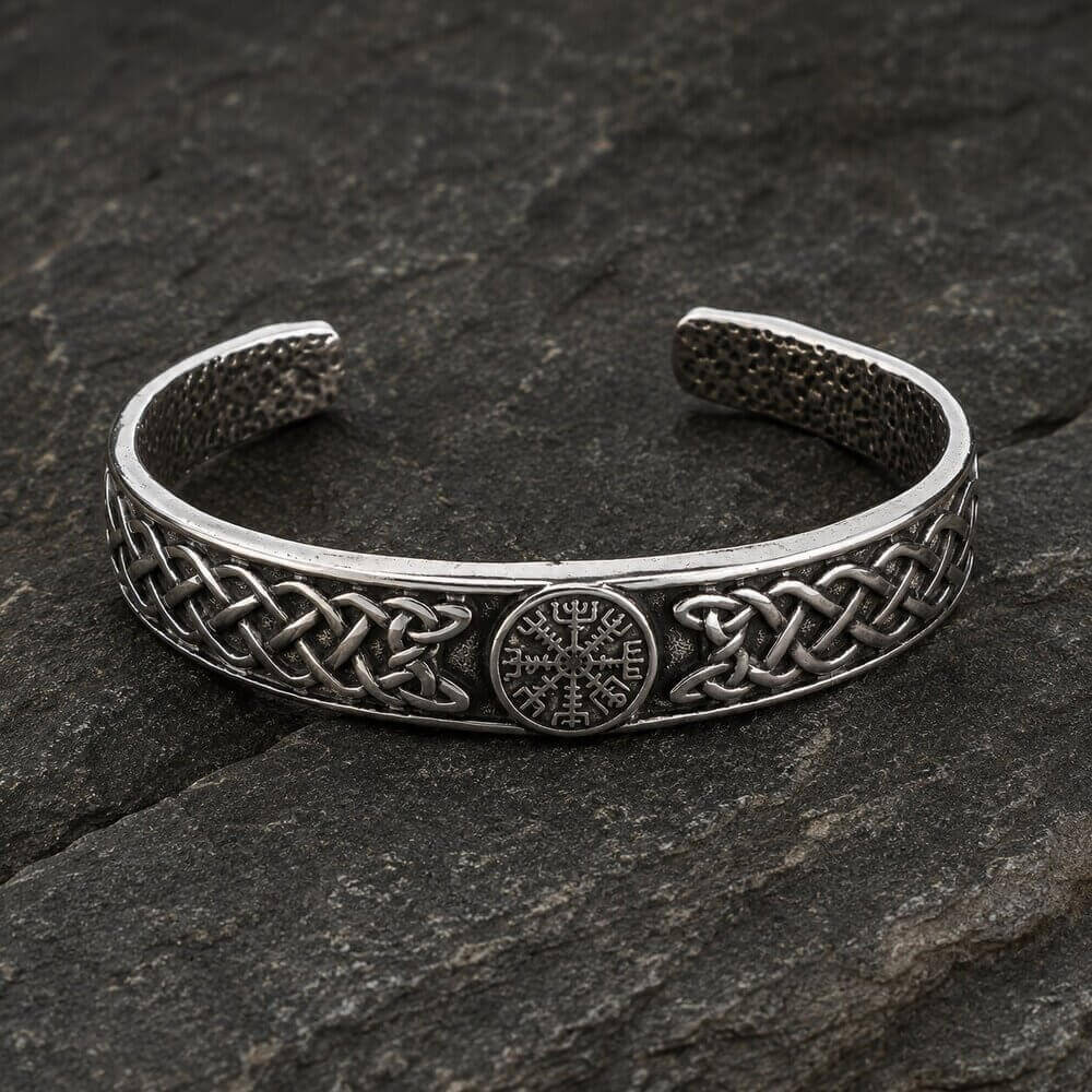 Viking Vegvisir Cuff Bracelet with Celtic Knotwork Open Band in silver on dark stone surface