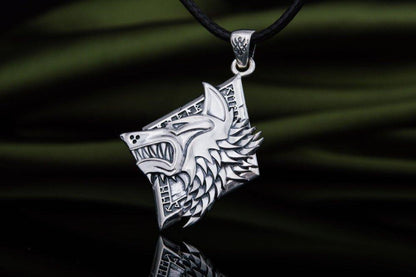 Sterling silver Viking wolf head pendant with intricate details on a black cord.