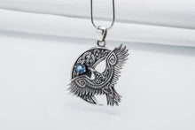 Viking 925 silver raven pendant with intricate Celtic knotwork and a blue gemstone.